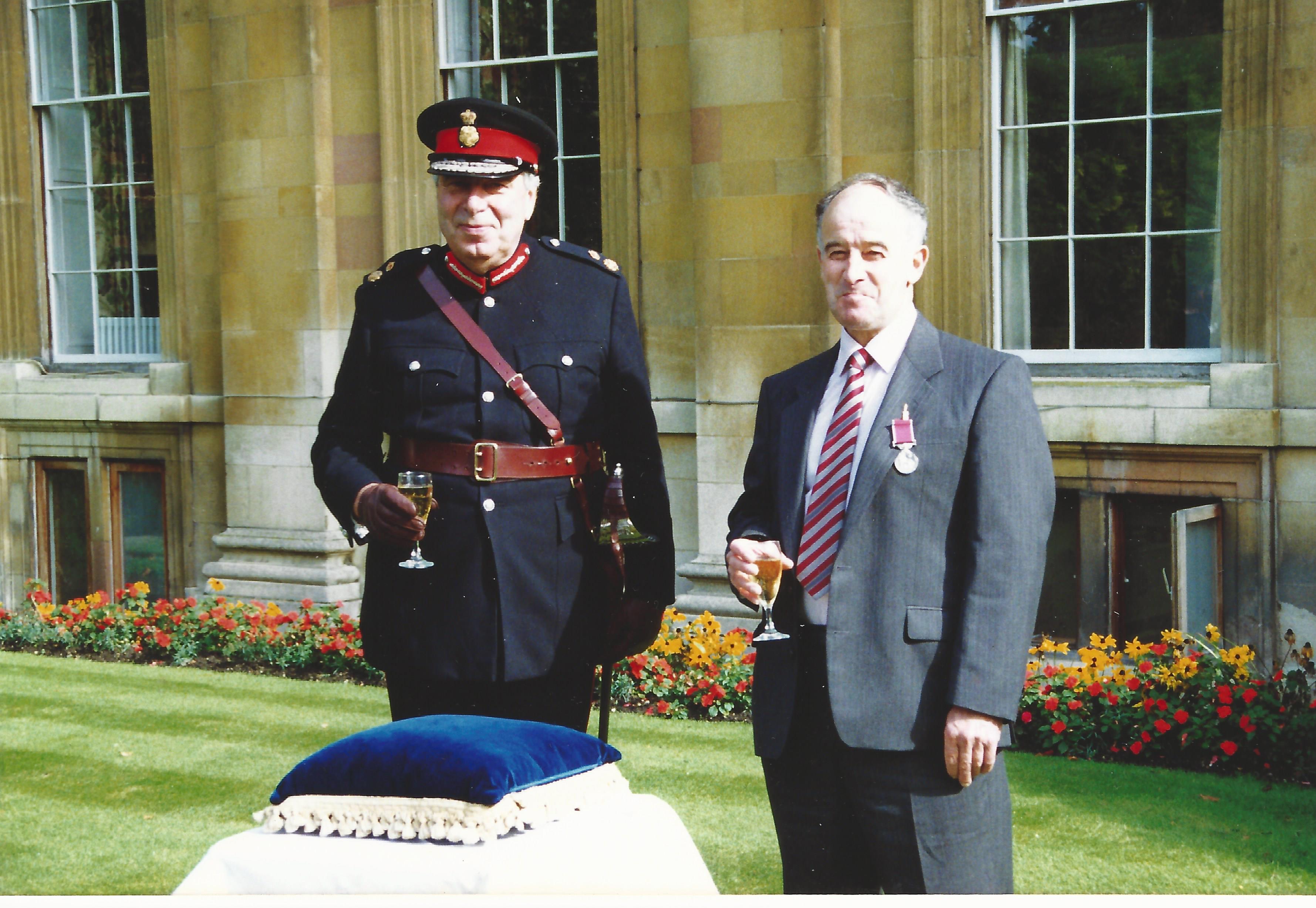 Brian Arbon receiving long service medal at Clare college 1992 from James Crowden, Lord Lieutenant