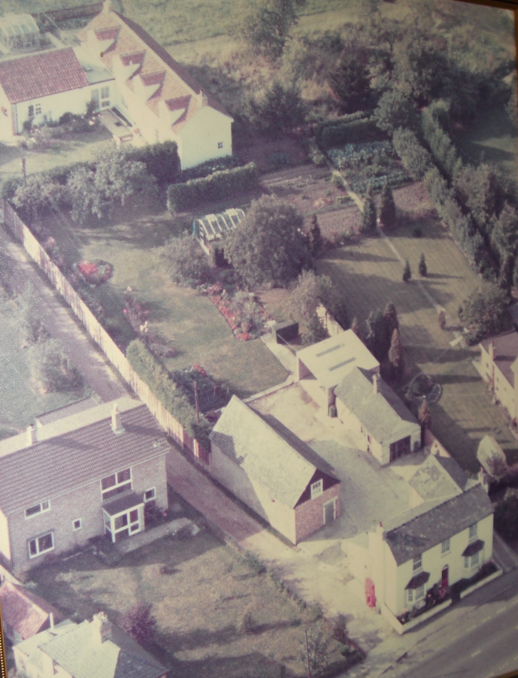 Aerial view of No 49 High St and large garden behind.