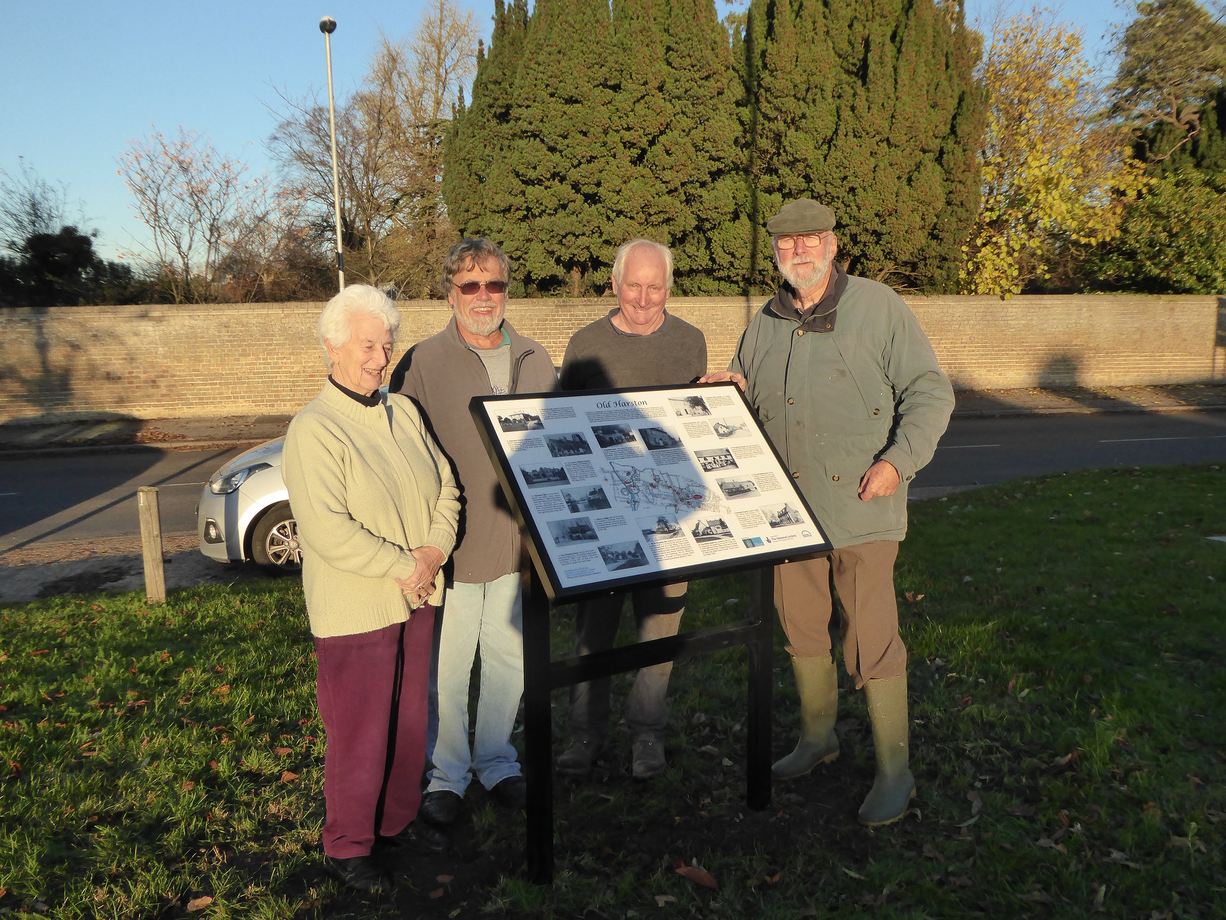 Irene Deacon (supplied photos), John Roadley (researcher), Nigel Schoepp, Peter Griffin (volunteer sign installers) beside the new Interpretation Board on The Green, Nov 2016