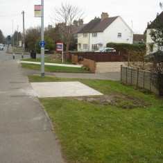 PZZF04.02 Bus Stop A10 verge No 118 High Street east Feb 2016 Bus Stop A10 verge No 118 High Street east Feb 2016. New concrete base. | (Griffin)